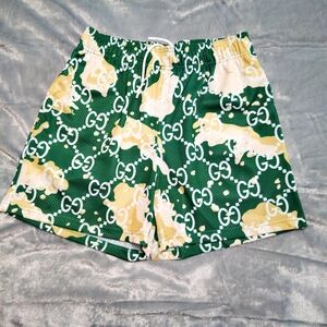 Bravest Studios Green and Yellow Athletic Shorts with Geometric Design